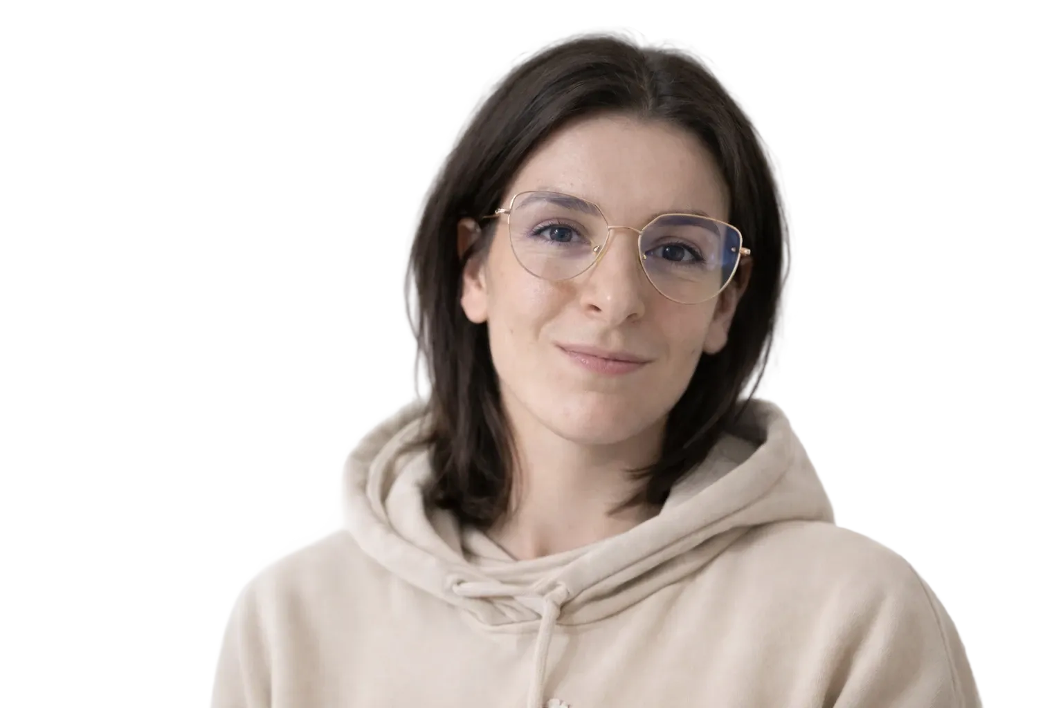 Young smiling woman in glasses and a beige sweatshirt.